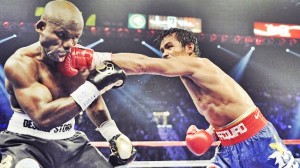 Manny Pacquiao, from the Philippines, right, lands a left to the head of Timothy Bradley, from Palm Springs, Calif., in their WBO world welterweight title fight Saturday, June 9, 2012, in Las Vegas. (AP Photo/Chris Carlson)