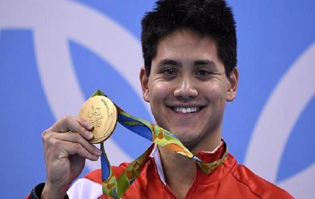 Joseph Isaac Schooling with his Olympic gold medal.