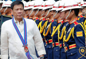 President Rodrigo Duterte along with incoming PNP chief Ronald dela Rosa (left), troops the line during the assumption of command ceremony at Camp Crame on Friday, July 1, 2016.(REY BANIQUET/PPD)