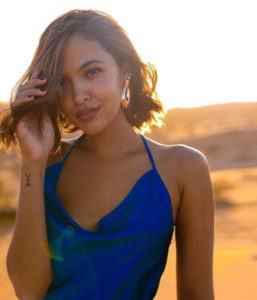 Beach photo of Maggie Wilson with shark