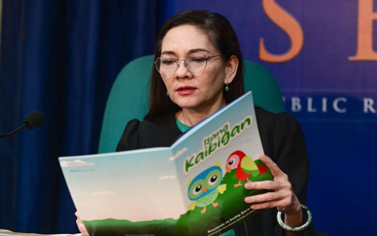 Senator Hontiveros Holding Sara Duterte Book