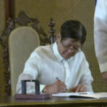 Marcos Signing an EO